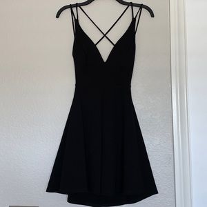 Backless black mini dress